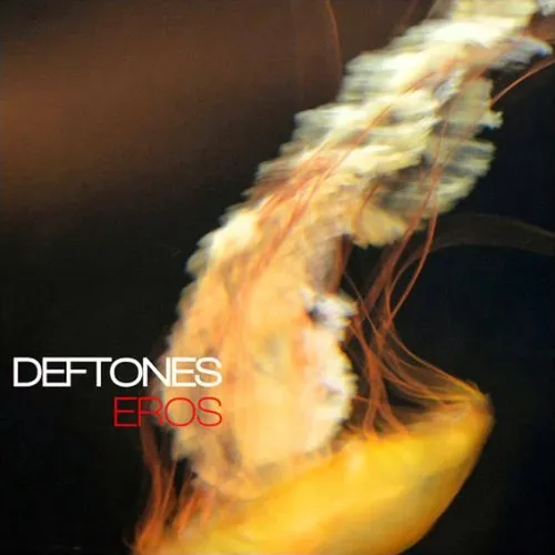 Deftones Eros album cover - golden jellyfish floating against a dark background with DEFTONES and EROS text